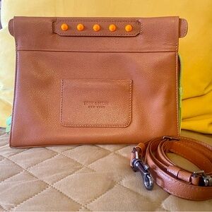 Min & Mon brown leather crossbody purse with  caring straps/handles.